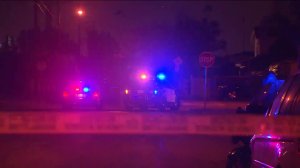 Los Angeles Police Department vehicles are seen outside a Rosemead home during a standoff on Dec. 29, 2015. (Credit: KTLA)