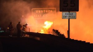 The Solimar Fire comes up against the 101 Freeway in Ventura County on Saturday. (Credit: KTLA) 