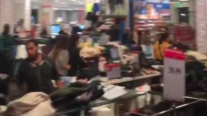 A screenshot from an Instagram video show panicked shoppers running through a store at Westfield MainPlace in Santa Ana on Dec. 18, 2015. (Credit: Calvin Ramirez)