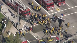 Firefighters set up triage areas in response to an active shooter incident in San Bernardino on Dec. 2, 2015. (Credit: KTLA)