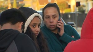 Parents and students are seen outside of a school after LAUSD campuses were closed amid a threat Tuesday. (Credit: KTLA)