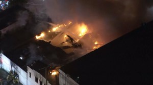 A large fire burned at a single-story commercial building in South Los Angeles on Dec. 11, 2015. (Credit: KTLA)