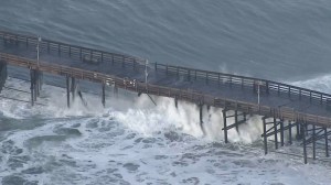 Powerful waves hit the Ventura Pier, causing damage and forcing officials to close it on Dec. 11, 2015. (Credit: KTLA)