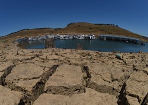 Dried mud and the remnants of a marina are shown at the New Melones Lake reservoir, on May 25, 2015, when it was at less than 20 percent capacity. (Credit: MARK RALSTON/AFP/Getty Images)