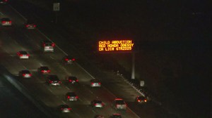 A sign on the 5 Freeway alerts drivers to Caleb Castro's abduction on Jan. 7, 2016. (Credit: KTLA)