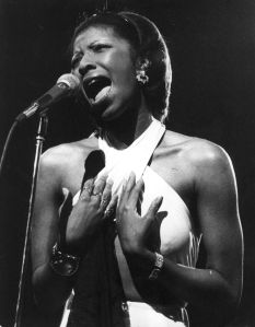 Soul singer Natalie Cole is seen in concert at London's New Victoria Theatre on Sept. 30, 1976.  (Credit: Gary Merrin/Keystone/Getty Images)