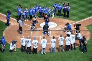 Vin Scully throws out the ceremonial first pitch to Orel Hershiser before the game against the San Francisco Giants on opening day at Dodger Stadium on April 4, 2014. (Credit: Harry How/Getty Images)