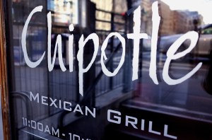 The Chipotle logo is seen on the door of one of its restaurants on Jan. 11, 2015, in Washington, DC. The embattled Mexican fast-food chain is under increased scrutiny following outbreaks of food-born illnesses which lead a decline in share prices. (Credit: MANDEL NGAN/AFP/Getty Images)