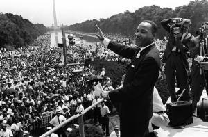 The civil rights leader Martin Luther KIng (C) waves to supporters in August 1963 on the Mall in Washington DC during the "March on Washington." King said the march was "the greatest demonstration of freedom in the history of the United States." (Credit: -/AFP/Getty Images)