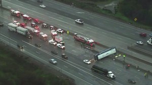 Officials are seen responding to a deadly crash involving a Greyhound bus in San Jose on Jan. 19, 2016. (Credit: KGO)