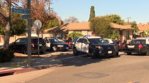 Police are seen at a barricade situation in Long Beach on Jan. 1, 2016. (Credit: KTLA)