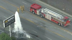 A person was trapped after a vehicle crashed into a hydrant in the Montebello area on Jan. 12, 2016. (Credit: KTLA)