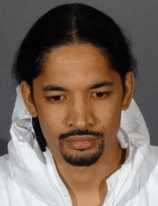 The Covina Police Department provided this booking photo of Michael Charles Parker, a 31-year-old Domino's Pizza delivery man, after he allegedly attacked a customer on Jan. 2, 2015. 