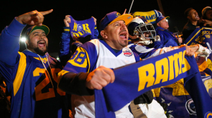 Alfredo Prieto, center, joins dozens of other Rams fans at Hollywood Park on Jan. 12, 2016, to celebrate the team's homecoming. (Credit: Robert Gauthier / Los Angeles Times)