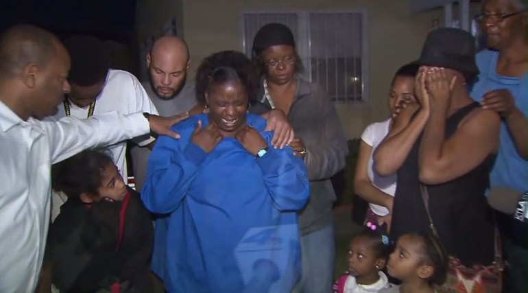 Family members mourn the death of baby Autumn Johnson on Feb. 10, 2016. (Credit: KTLA)