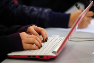 This photo taken on January 7, 2010 shows a woman typing on the keyboard of her laptop computer. (Credit: FREDERIC J. BROWN/AFP/Getty Images)