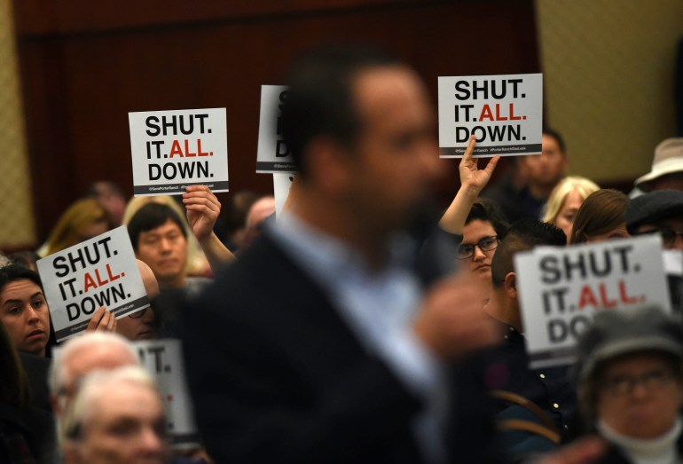 A Porter Ranch resident addresses an AQMD board over the continuing gas leak on Jan. 23, 2016. (Credit: MARK RALSTON/AFP/Getty Images)