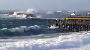 High surf battered the Redondo Beach Pier on Sunday, Jan. 31, 2016. (Credit: Mike Galliano)