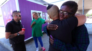 A tearful Julia Briggs Cannon, 58, right, receives a hug from Marisol Viera before Elvis Summers, left, has to remove the small home he built for her. (Credit: Genaro Molina/Los Angeles Times)