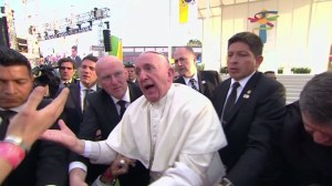 Pope Francis scolds a man who pulled him down as he was greeting a crowd in Mexico. (Credit: Pool via CNN) 