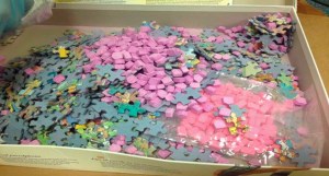 Ecstasy pills and puzzle pieces are seen in a photo provided by the Riverside Police Department. 