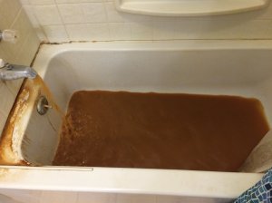 In St. Joseph, Louisiana, tap water sometimes comes out brown or yellow. St. Joseph resident Garrett Boyte shows what came out of his bathtub faucet in late January. (Credit: Garrett Boyte via CNN Wire)