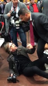 A screenshot from a video shows a Secret Service agent standing over a Time magazine photographer at a Donald Trump rally in Virginia on Feb. 29, 2016. (Credit: Joe Perticone/Independent Journal Review)