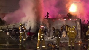 A UPS truck burst into flames after a multivehicle collision on the 5 Freeway in Commerce on Feb. 27, 2016. (Credit: Loudlabs) 