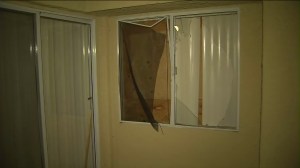 The man had tried to break-in to this window, which he apparently though led to his own bedroom, when he was fatally shot, his relatives said. (Credit: KTLA)