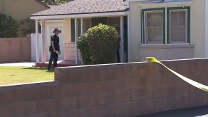 A San Gabriel police investigator responds on March 15, 2016, after an off-duty LAPD officer shot at burglars during a break-in in San Gabriel. (Credit: KTLA)