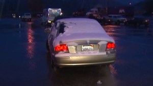 A snow covered car is seen in Frazier Park on March 7, 2016. (Credit: KTLA)