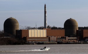 A boat moves along the Hudson River in front of the Indian Point nuclear power plant March 18, 2011 in Buchanan, New York. (Credit: Mario Tama/Getty Images)