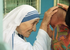 Mother Teresa blessing a child at the Gift of Love Home on Oct. 20, 1993 in Singapore. (Credit: ROSLAN RAHMAN/AFP/Getty Images)