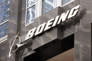 The Boeing logo hangs on the corporate world headquarters building of Boeing November 28, 2006 in Chicago, Illinois. (Credit: Scott Olson/Getty Images)