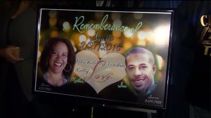 A poster displayed at a vigil in Carson shows photographs of slain mother and son, Michelle Kelly-Love and Jordan Love. (Credit: KTLA)