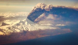 A volcanic eruption in Alaska sent ash 20,000 feet up in the air and prompted flight warnings, according to authorities. (Credit: Colt Snapp via CNN Wire)