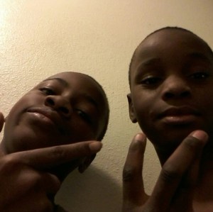 Jason Spears, right, was killed in the shooting, which injured Terrance Spears, left. The boys are seen in a photo provided to KTLA by family members. 