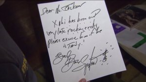 Bruce Springsteen signed a tardy note for a Claremont boy who was out late on a school night on attending a concert on March 15, 2016. (Credit: KTLA) 