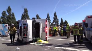 An ambulance overturned after a collision involving a conversion van in Fountain Valley on April 22, 2016. (Credit: Southern Counties News)