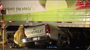 A pickup truck was flattened under a semitrailer in a collision in Vernon on April 30, 2016. (Credit: Loudlabs)