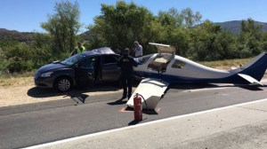 A plane crashed into the 15 Freeway in San Diego County, killing 1 and leaving 5 others injured on April 2, 2016. (Credit: Robert Burns / KSWB)