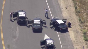 A driver surrenders to CHP in the Ontario area after a pursuit on April 19, 2016. (Credit: KTLA)