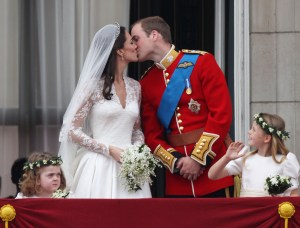 Their Royal Highnesses Prince William, Duke of Cambridge and Catherine, Duchess of Cambridge kiss on the balcony at Buckingham Palace on April 29, 2011 in London, England (Credit: Peter Macdiarmid/Getty Images)