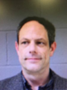 Jason M. Adams, a teacher at Newtown Middle School, was carrying a concealed firearm for which he had a permit, Newtown police said. (Credit: Newtown Police Department)