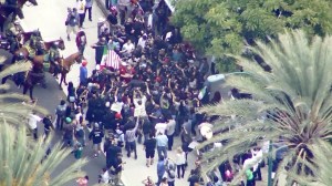 Mounted officers move in to break up an apparent confrontation outside a Donald Trump rally in Anaheim on May 25, 2016. (Credit: KTLA)