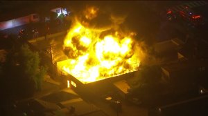 Dramatic flames rose from a commercial structure in South Gate on May 13, 2016. (Credit: KTLA)