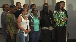 Robert Ellis' family members and supporters on May 9, 2016, await a press conference where an arrested in his killing was announced. (Credit: KTLA)