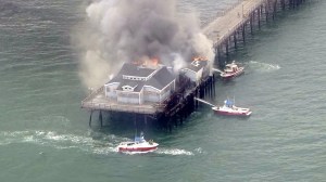 Fire boats respond to a fire on the Seal Beach Pier on May 20, 2016. (Credit: KTLA)