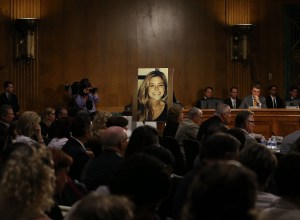 A large photo of Kathryn "Kate" Steinle who was killed by an illegal immigrant in San Francisco, is shown while her dad Jim Steinle testifies during a Senate Judiciary Committee hearing on Capitol Hill, July 21, 2015 in Washington, DC. The committee heard testimony from family members who have had loved ones killed by illegal immigrants. (Credit: Mark Wilson/Getty Images)