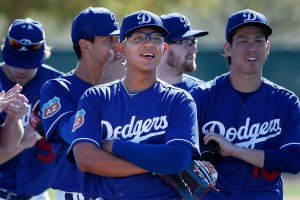 Starting pitcher Julio Urias, center, of the Los Angeles Dodgers participates in a spring training workout at Camelback Ranch on February 20, 2016, in Glendale, Arizona. (Credit: Christian Petersen/Getty Images)